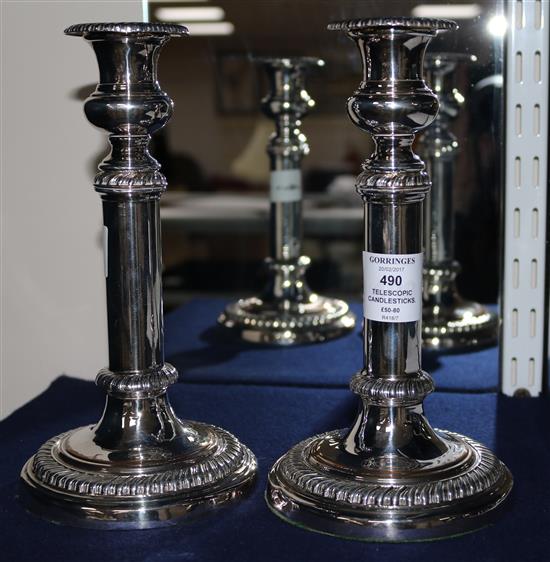 A pair of silver plated telescopic candlesticks, 8.75in.